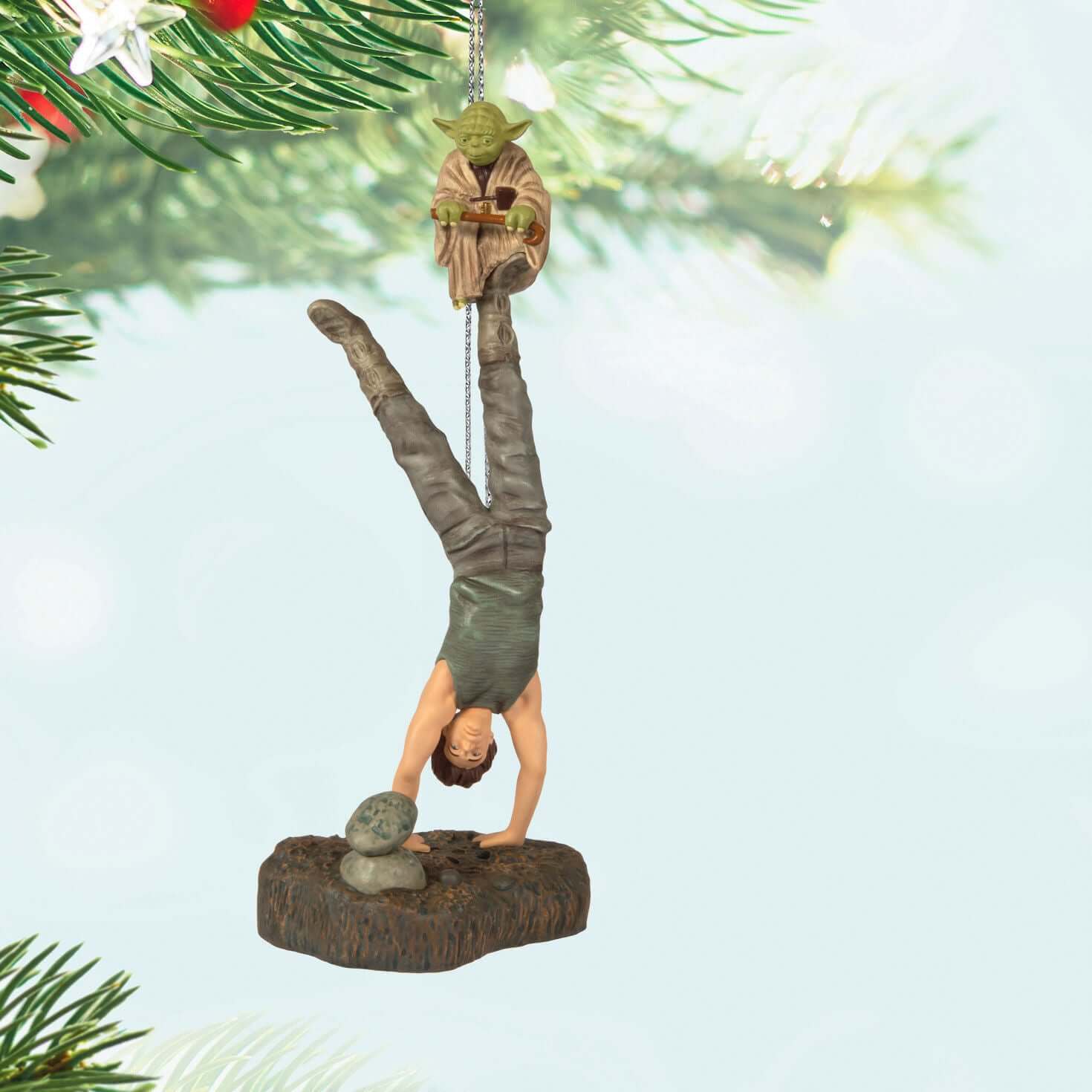 Star Wars™: The Empire Strikes Back™ There Is No Try Ornament With Sound — 2025 Hallmark Keepsake Christmas Ornament featuring Yoda and Luke Skywalker upside down, hanging from a Christmas tree branch.
