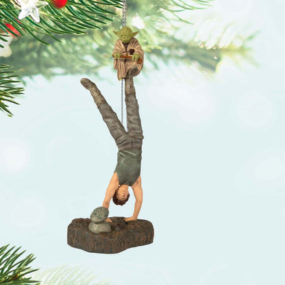 Star Wars™: The Empire Strikes Back™ There Is No Try Ornament With Sound — 2025 Hallmark Keepsake Christmas Ornament featuring Yoda and Luke Skywalker upside down, hanging from a Christmas tree branch.