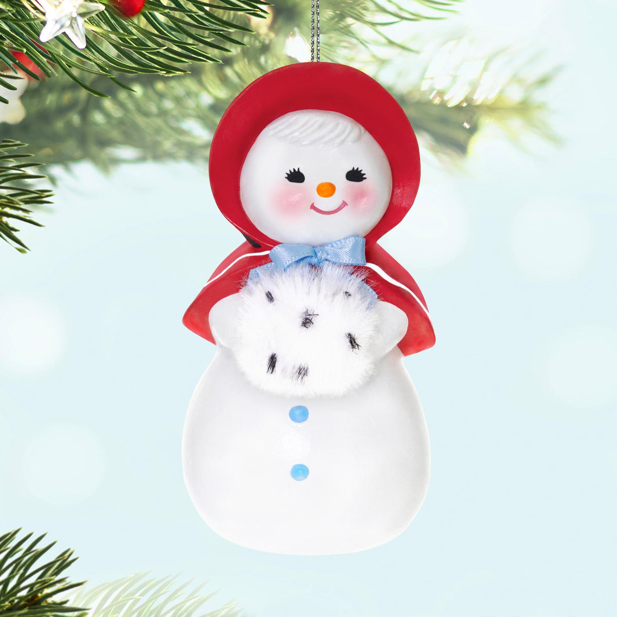 Sweet Snow Girl — 2025 Hallmark Keepsake Christmas Ornament, retro snow lady in red bonnet holding a fluffy muff, hanging decoration.