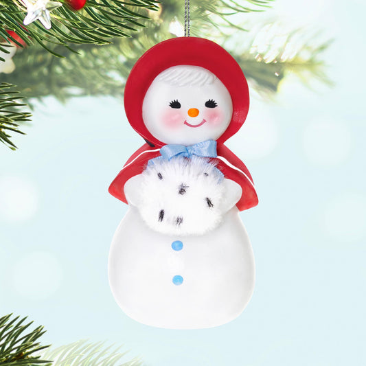 Sweet Snow Girl — 2025 Hallmark Keepsake Christmas Ornament, retro snow lady in red bonnet holding a fluffy muff, hanging decoration.