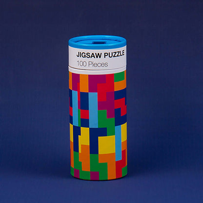 Tetris™ Mug and Puzzle jigsaw puzzle in bright colours, cylindrical packaging on a dark background.