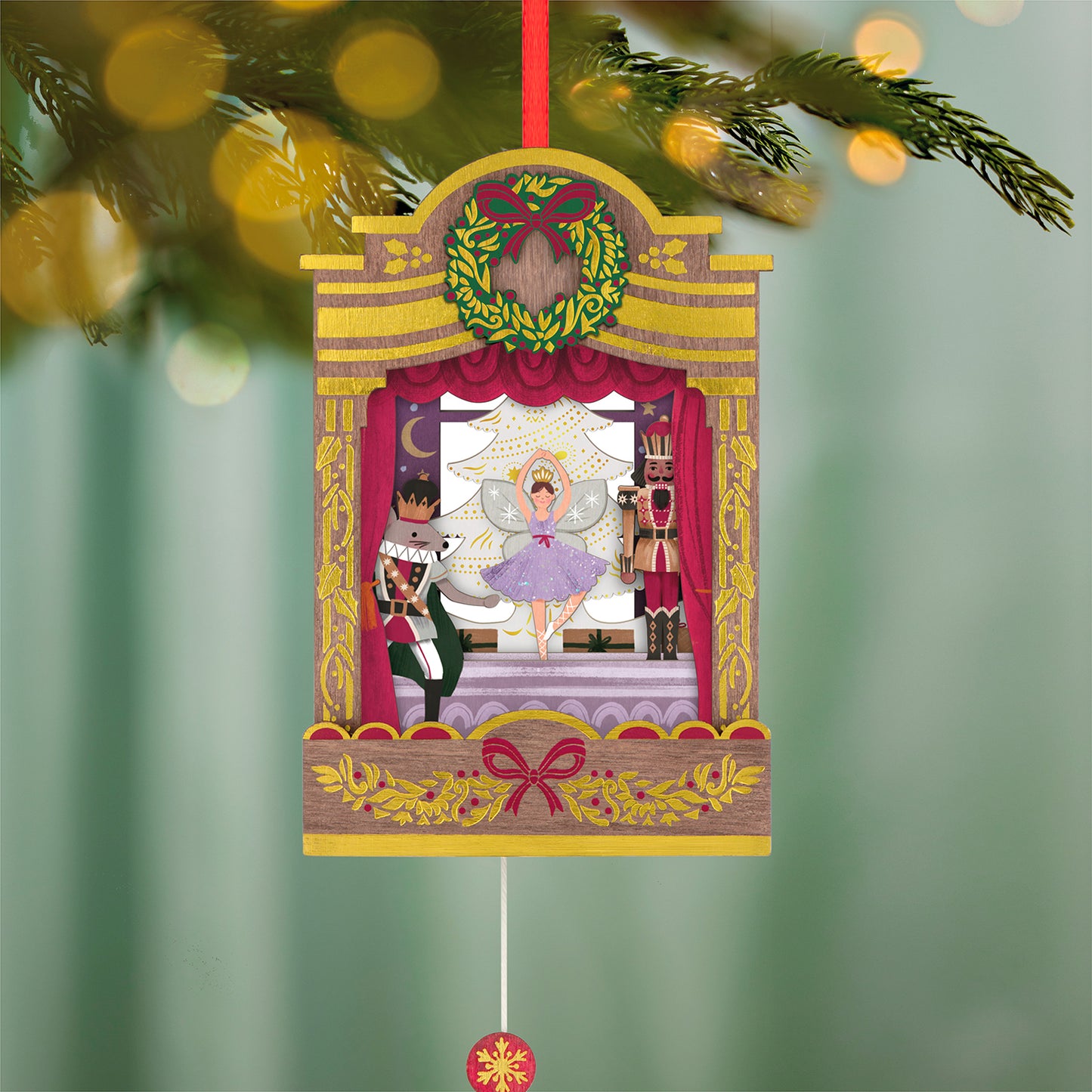 The Nutcracker Ballet Musical With Motion, Papercraft — 2026 Hallmark Keepsake Christmas Ornament, showcasing intricate stage details with figurines, hanging on a Christmas tree.