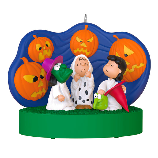 The Peanuts® Gang 60th Anniversary Spooked Trick-or-Treaters With Light and Sound — 2026 Hallmark Keepsake Halloween Ornament featuring Charlie Brown, Linus, and Lucy in costume with jack-o'-lanterns backdrop.