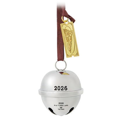 The Polar Express™, Santa's Sleigh Bell 2026, metal ornament featuring a gold train ticket and dated 2026, hanging with a ribbon.