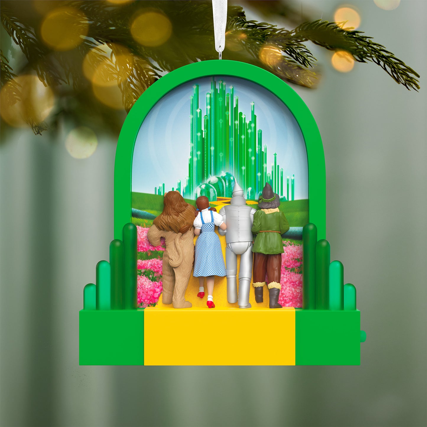The Wizard of Oz™ Journey to the Land of Oz With Light — 2026 Hallmark Keepsake Christmas Ornament featuring Dorothy, Tin Man, Scarecrow, and Cowardly Lion with the Emerald City backdrop.