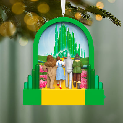 The Wizard of Oz™ Journey to the Land of Oz With Light — 2026 Hallmark Keepsake Christmas Ornament featuring Dorothy, Tin Man, Scarecrow, and Cowardly Lion with the Emerald City backdrop.