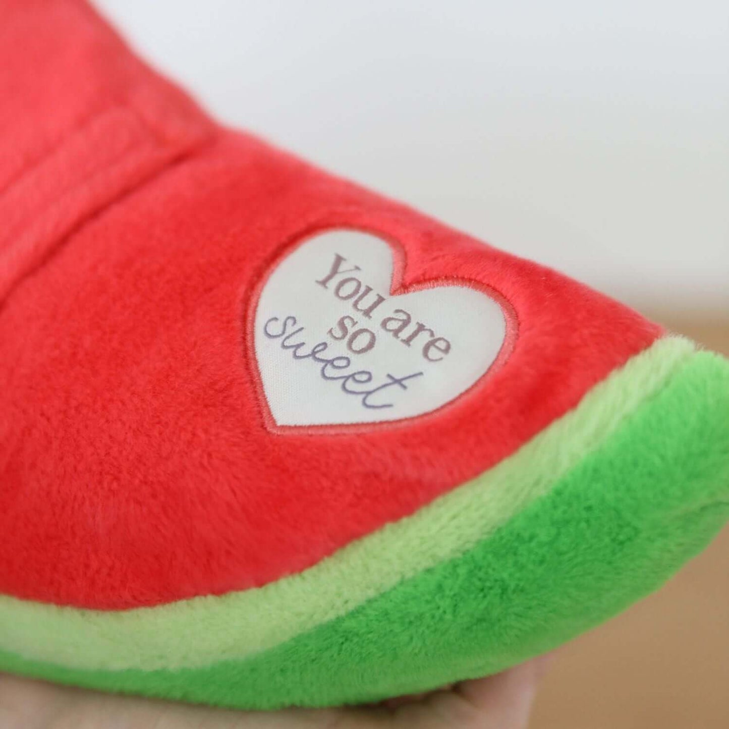 Toasty Hugs Quotes Winnie Watermelon soft plush toy featuring heart with text detail, vibrant watermelon design.