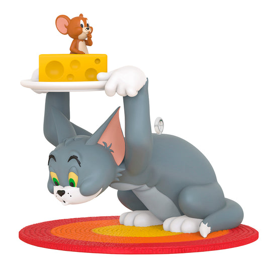 Tom and Jerry™ Hide and Seek — 2026 Hallmark Keepsake Christmas Ornament featuring Tom the cat holding cheese over Jerry on a colourful rug.