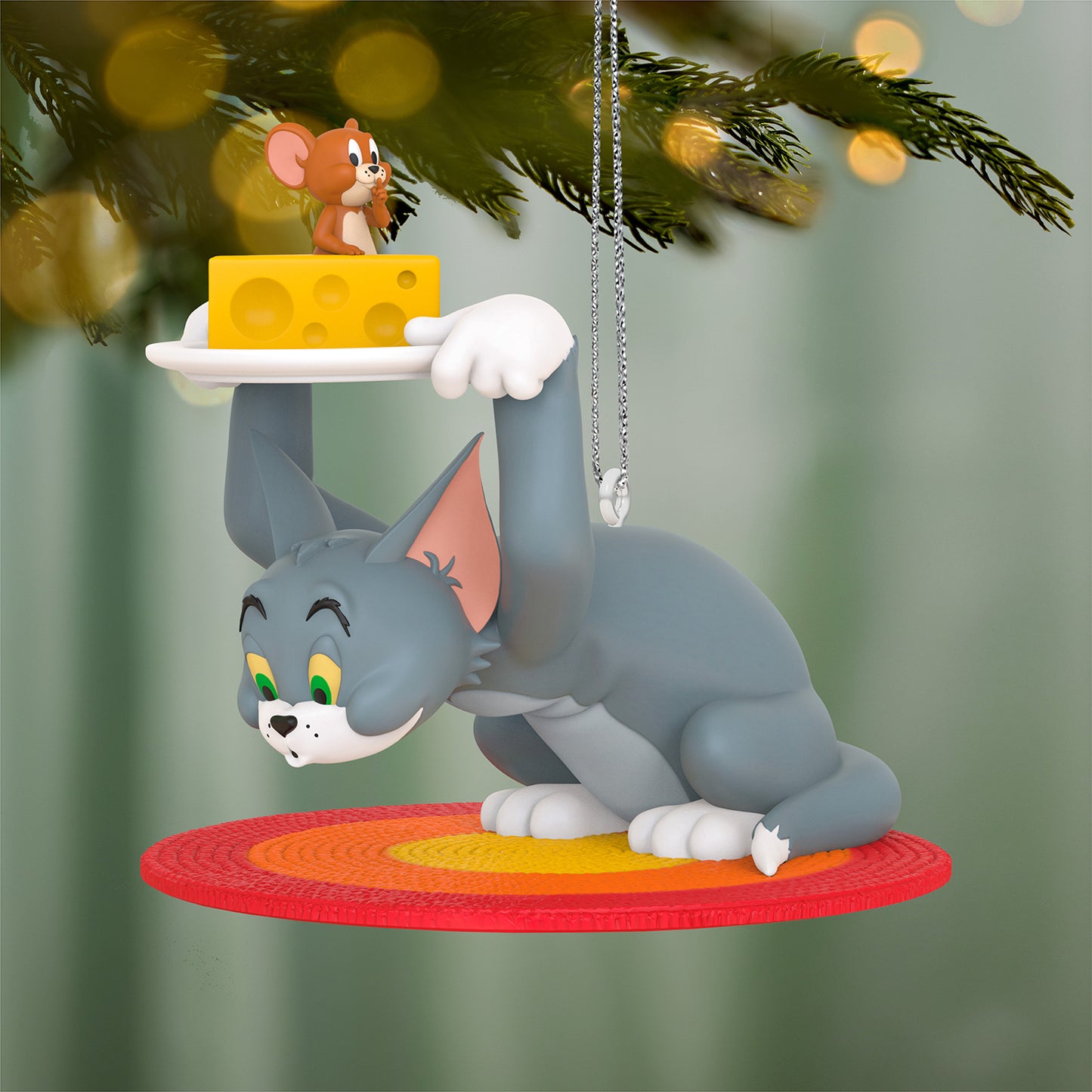 Tom and Jerry™ Hide and Seek — 2026 Hallmark Keepsake Christmas Ornament featuring Tom holding cheese over Jerry, detailed on a colourful braided rug.