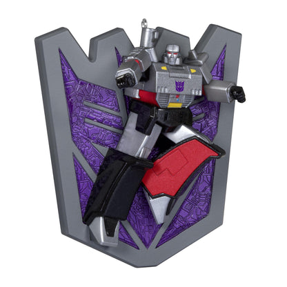 Transformers™, Megatron's Might — 2025 Hallmark Keepsake Christmas Ornament featuring a detailed Megatron figurine in action pose against a Decepticon shield.