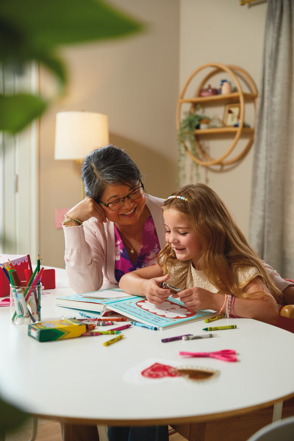 What I Love About You! A Color-Your-Own Recordable Storybook, flat lay with a grandmother and granddaughter sharing creative moments.