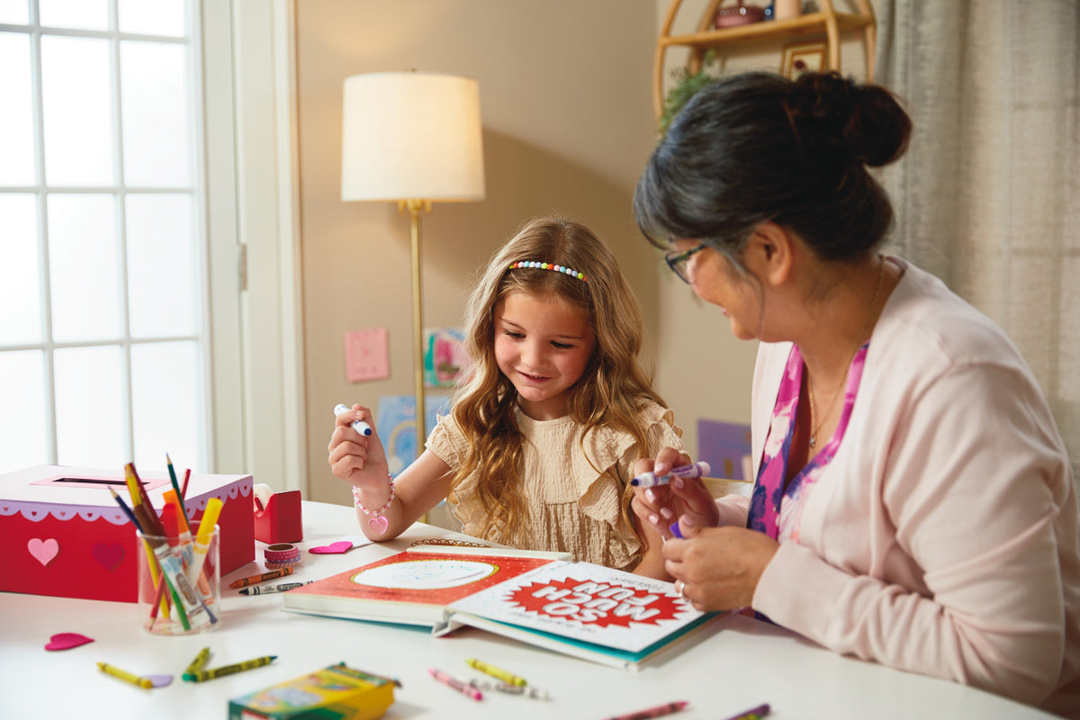 What I Love About You! A Color-Your-Own Recordable Storybook with child and adult colouring together at a table.