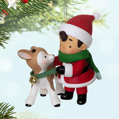 Young Santa, 4th in the Series — 2025 Hallmark Keepsake Christmas Ornament featuring a young Santa with a reindeer, close up view.