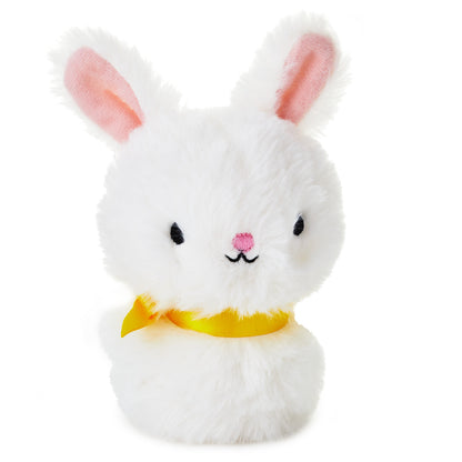 Hallmark Zip-a-Long Bunny Stuffed Animal in white plush with pink ears and a yellow satin ribbon, close up view.