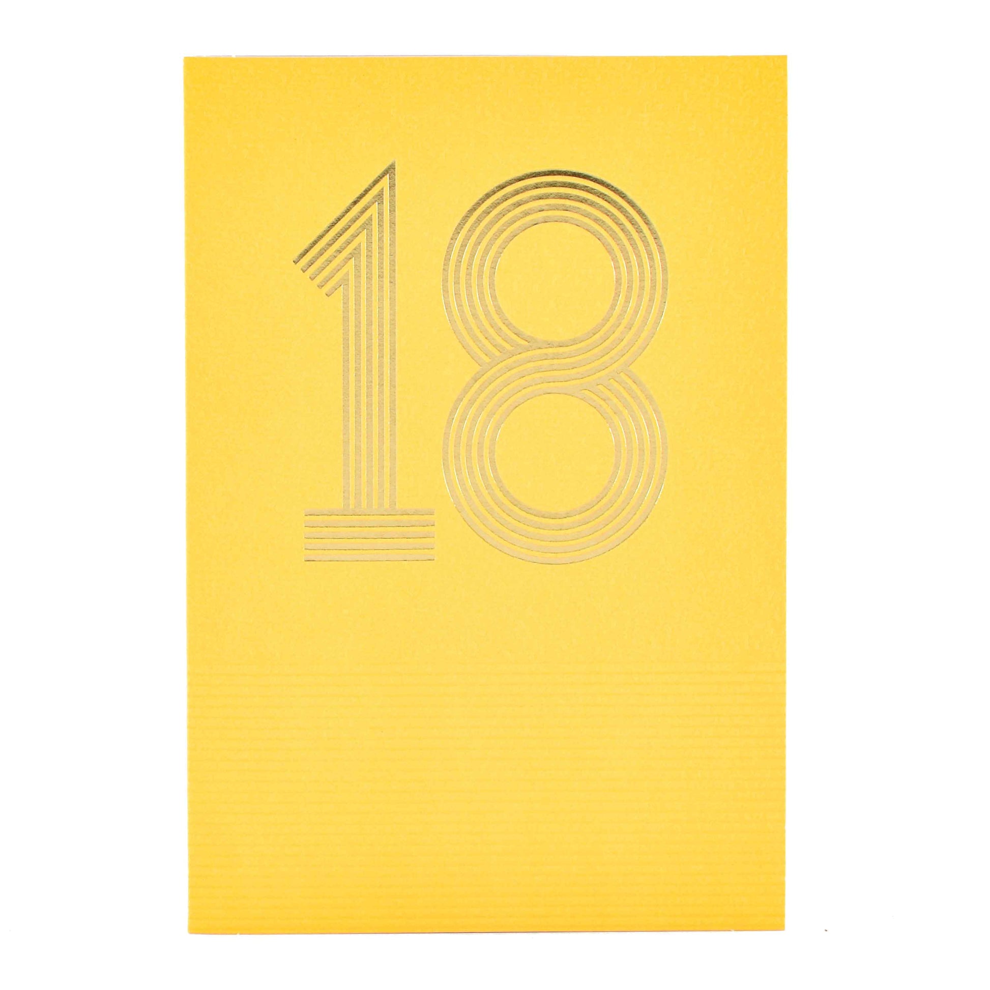 Signature Studio 18th Birthday Card - Wishing You Happiness! embossed yellow card with gold foil '18' design in a flat lay view.
