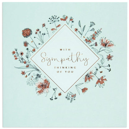 Thinking of Elegant You Sympathy Card on soft baby blue background with floral illustrations and rose gold foil details.