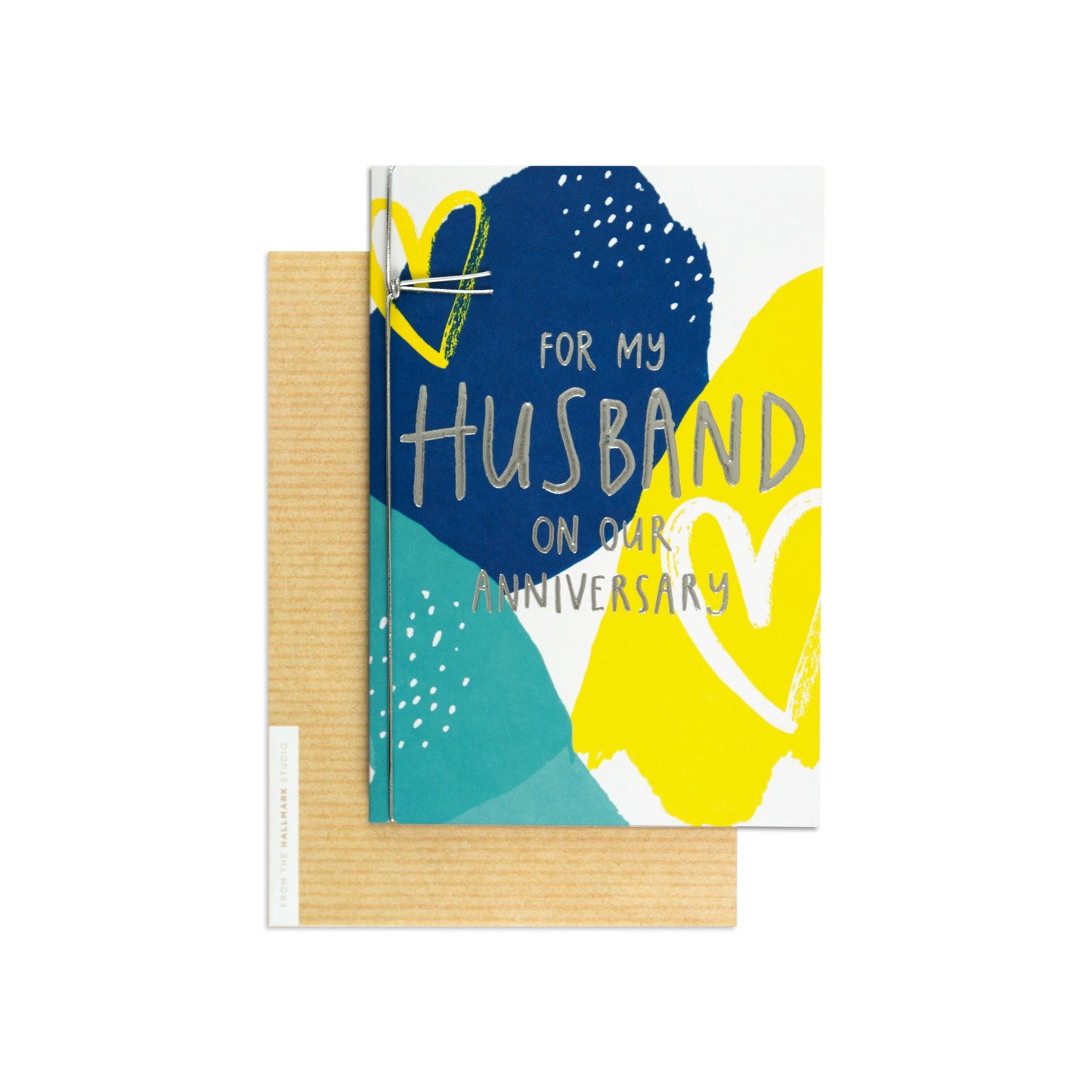 For my husband contemporary colourful anniversary card with blue and yellow abstract design, flat lay with kraft envelope.