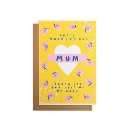 Mother's Day card - Helping Me Grow, colourful floral design, bright yellow background, flat lay view.