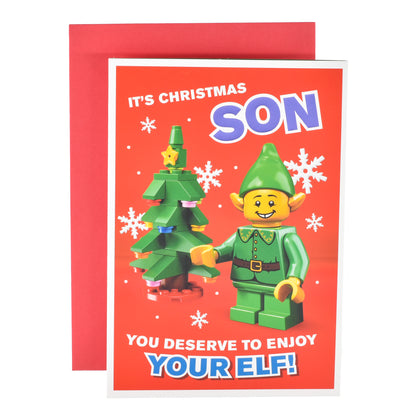 Hallmark Christmas Card For Son - Lego with red envelope, featuring a Lego elf and Christmas tree illustration on a bright red background.