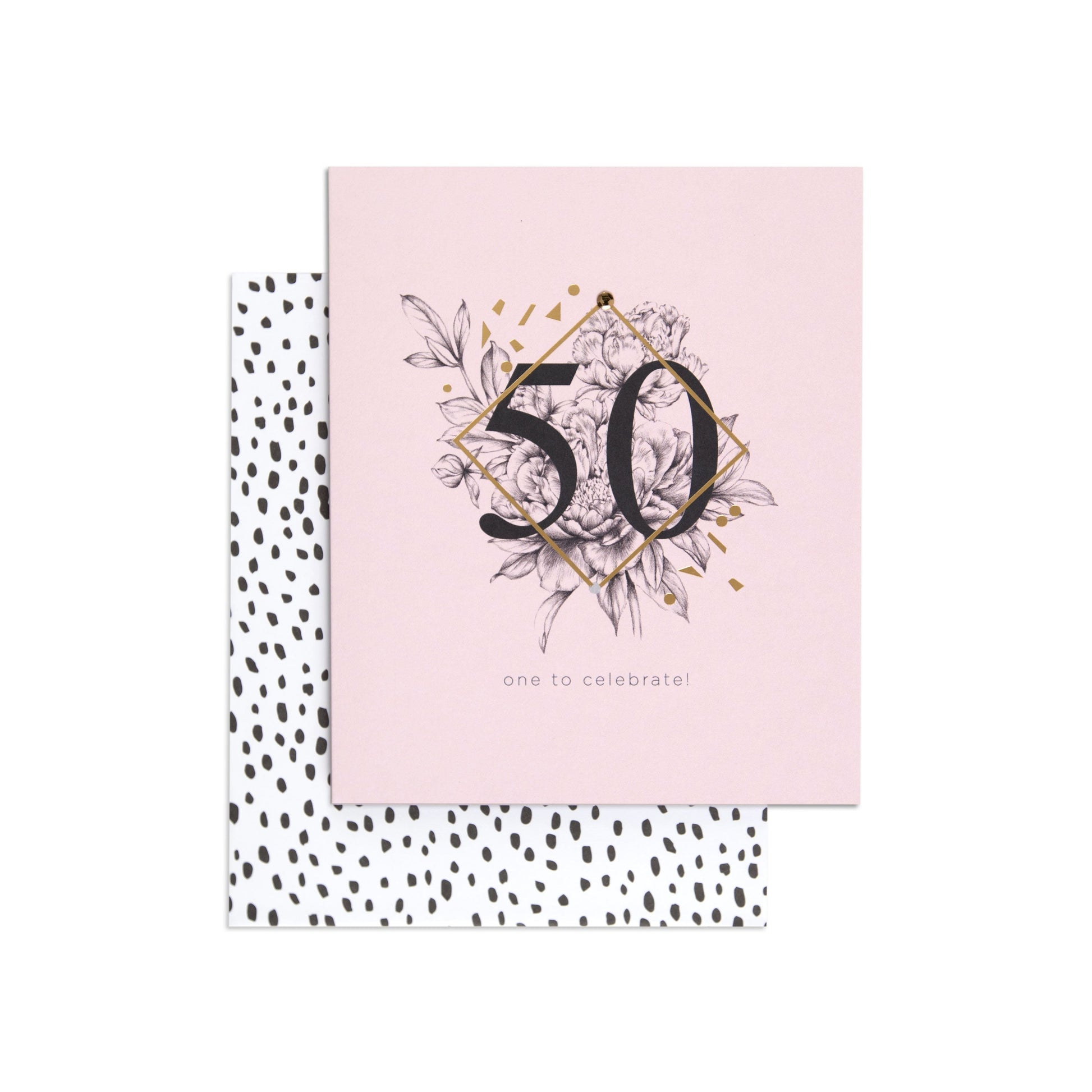 One To Celebrate Refined 50th Birthday Card with gold foil details, floral illustration, and patterned back, flat lay view.
