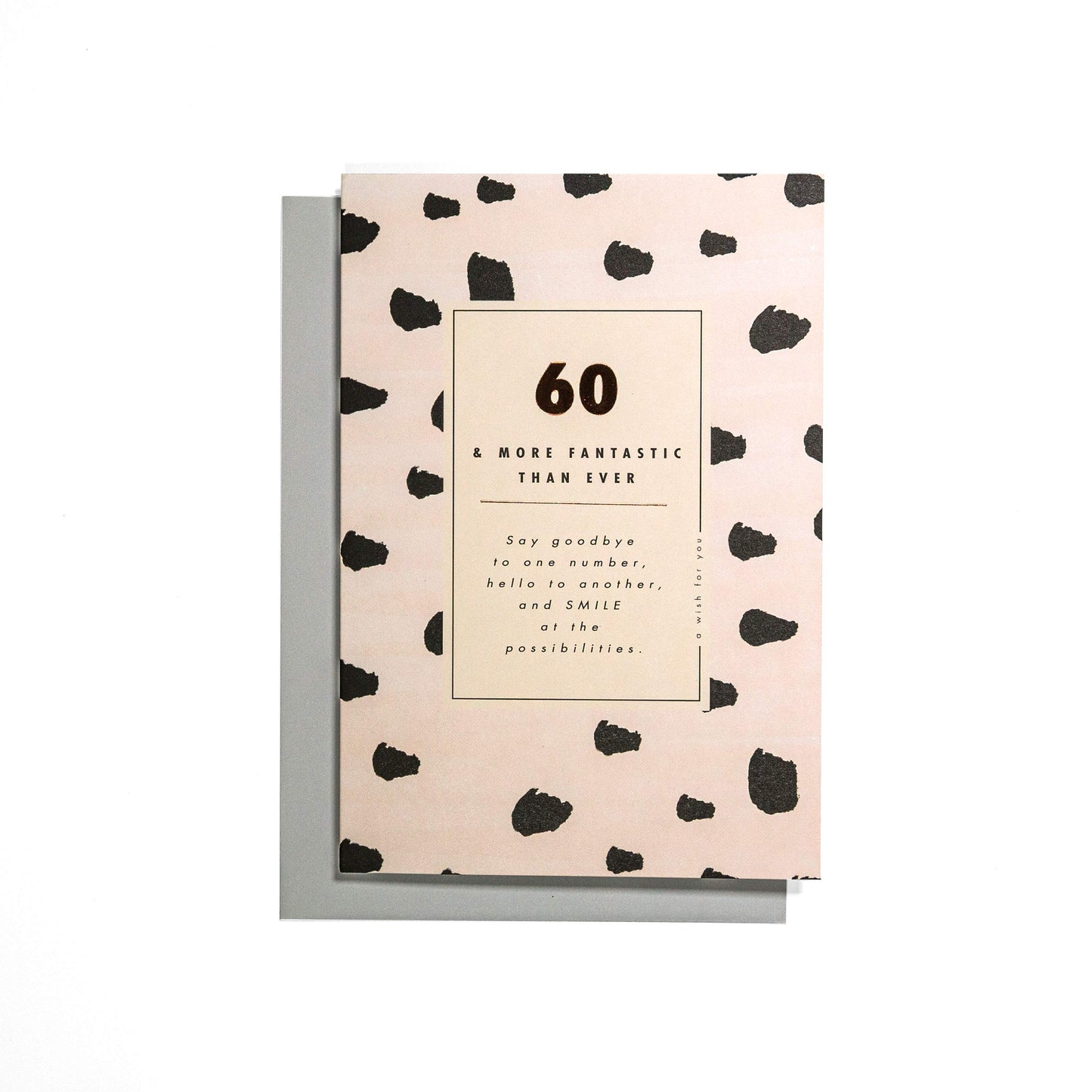 60 & More Fantastic Than Ever Stylish 60th Birthday Card featuring a pink pattern, with a grey envelope, flat lay view.