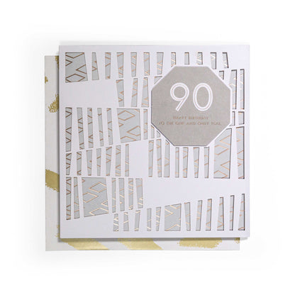 Contemporary Gold 90th Birthday Card featuring a 3D laser-cut overlay and gold foil highlights, flat lay view.
