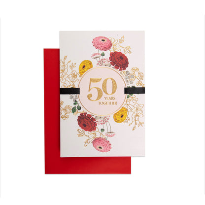 Five Decades Together Floral 50th Anniversary Celebration Card featuring floral design, gold foil, and black ribbon against a red envelope.