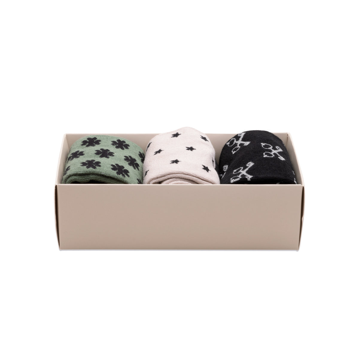 Lucky Socks set of three pairs in a box with unique lucky icons, showcasing green, white, and black colours.