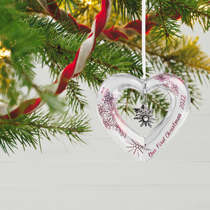 Our First Christmas Heart Glass — Hallmark Keepsake Ornament, elegant glass heart design, featuring snowflake charm, hanging on tree.
