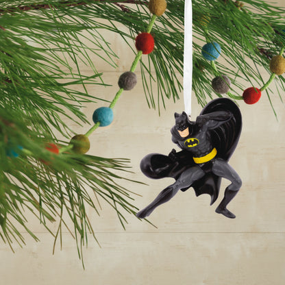 DC Comics Batman - Hallmark Christmas Ornament hanging from a tree branch, featuring Batman in a dynamic pose with a black cape.