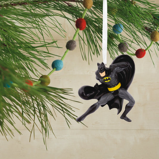 DC Comics Batman - Hallmark Christmas Ornament hanging from a tree branch, featuring Batman in a dynamic pose with a black cape.