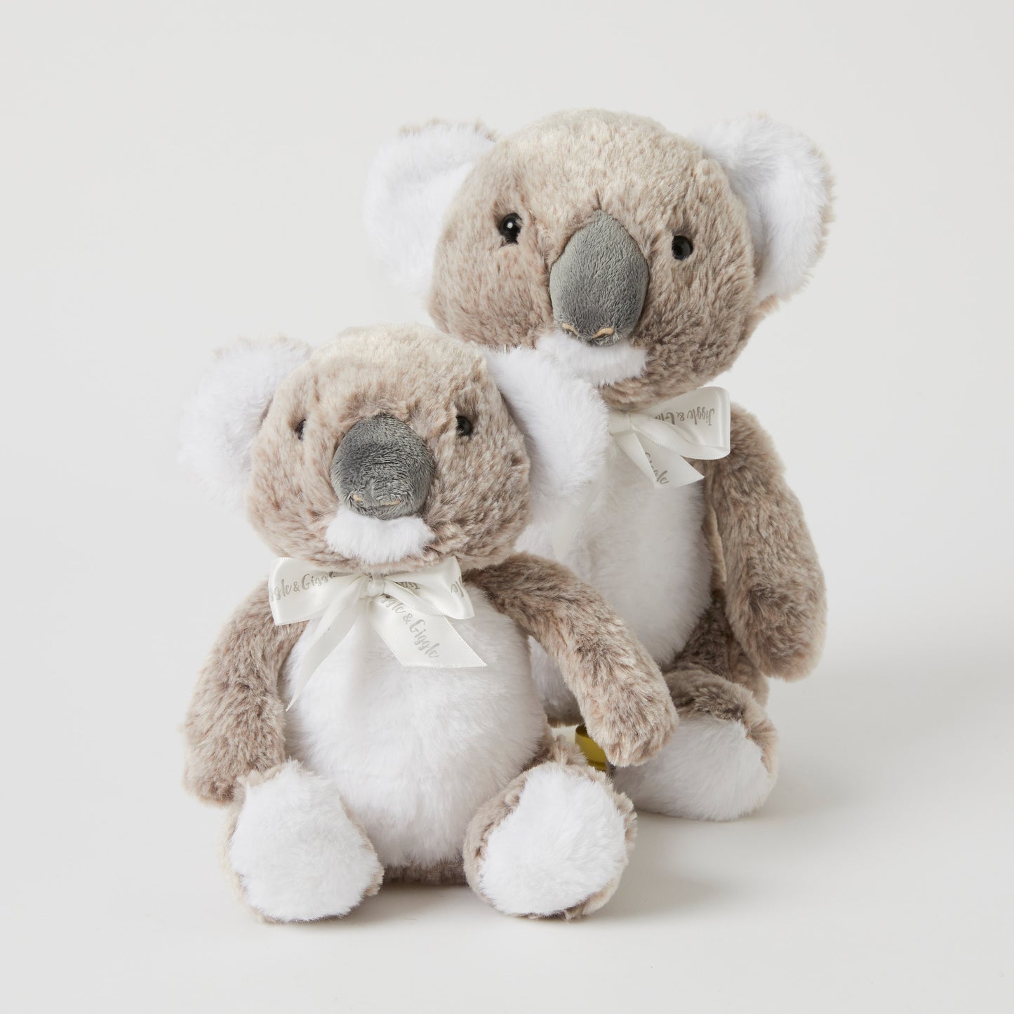The Koala Family Set Of 2 plush toys, featuring a small and large koala with soft fur and decorative bows, angled view.