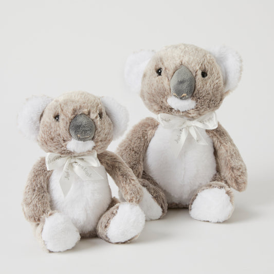 The Koala Family Set Of 2 plush toys, featuring small and large koalas with grey fur and white accents in a flat lay arrangement.