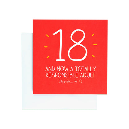 Responsible adult funny 18th birthday card in red, featuring humorous text and white envelope, flat lay view.